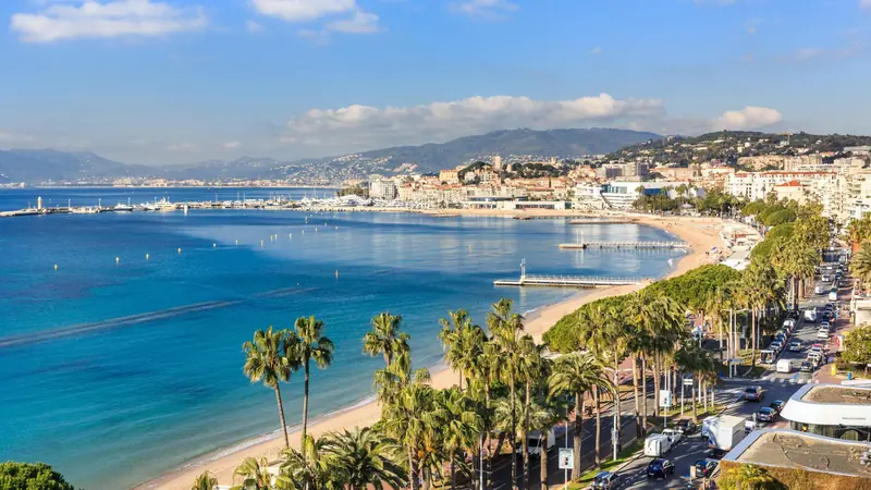 The bay of Cannes and the Croisette seen from above, with the old port beyond
