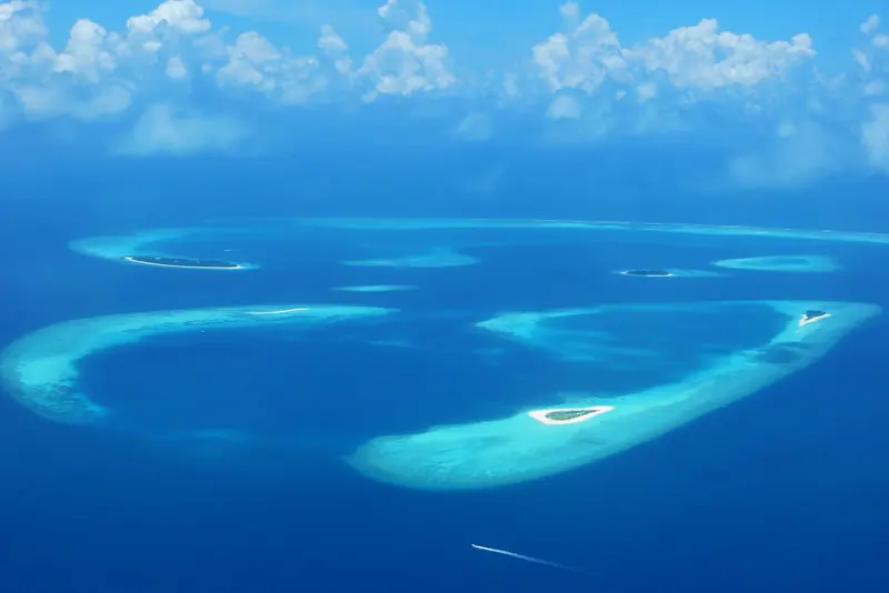 Aerial view of coral atolls and lagoons in the Maldives
