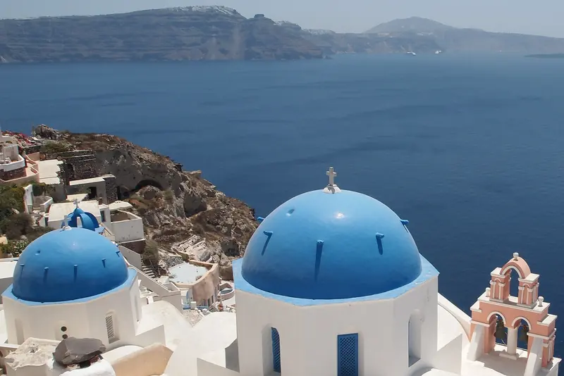 Blue domed churches of Oia above the Santorini caldera