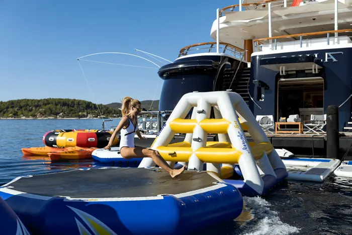 Inflatable water park beside a superyacht