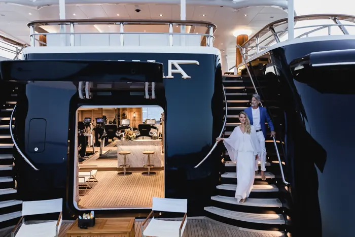 Guest stepping down to the beach club of a superyacht