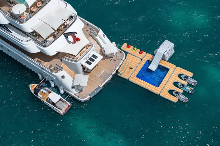 Aerial view of a yacht with a floating sea pool